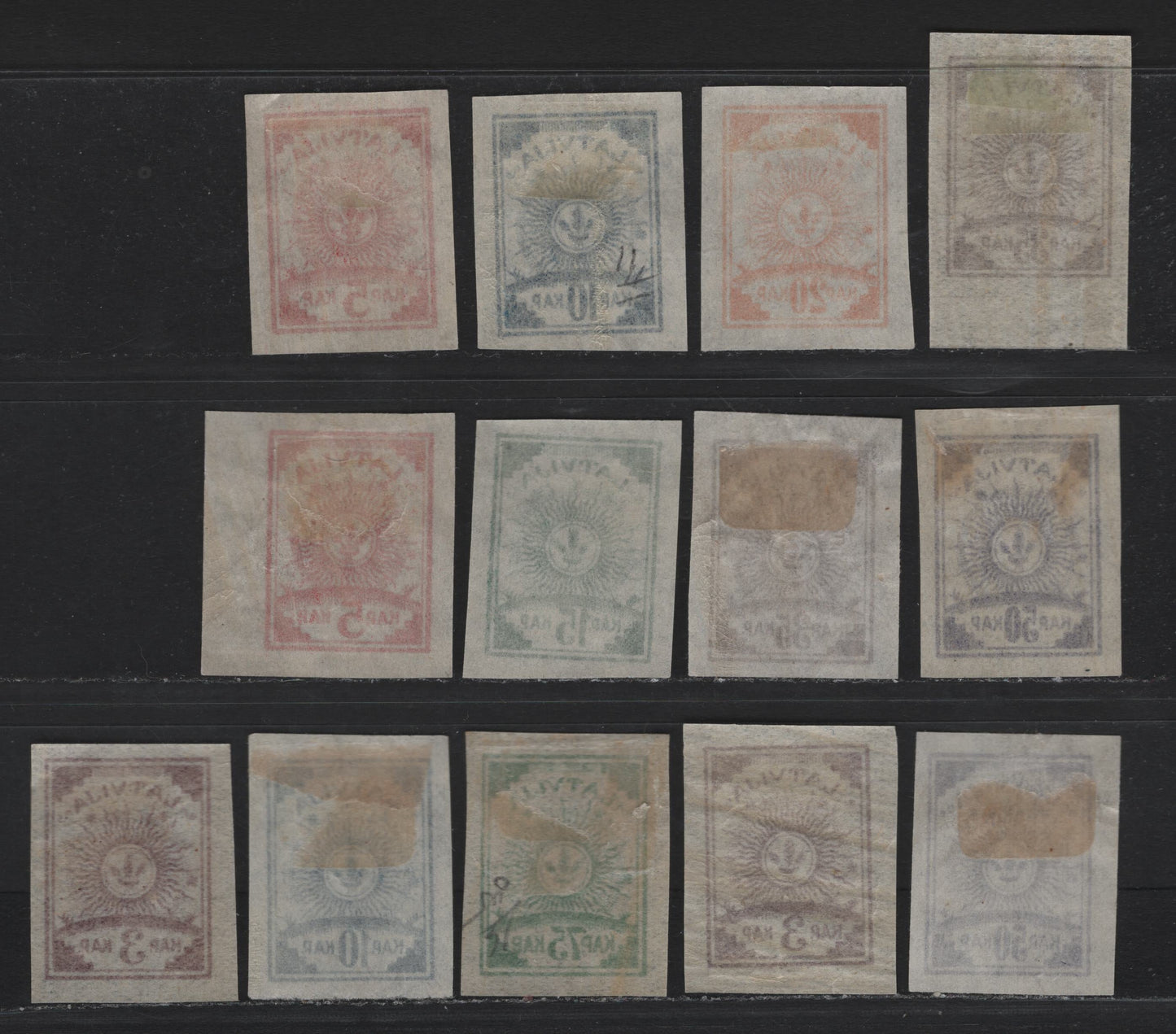 Lot 191 Latvia SC#9-16 3k - 75k Lilac - Emerald , 1919 Arms Issue, 13 VFOG Singles, Pelure Paper, Complete OG Set With Shade Variations, Except The 25k Gray.