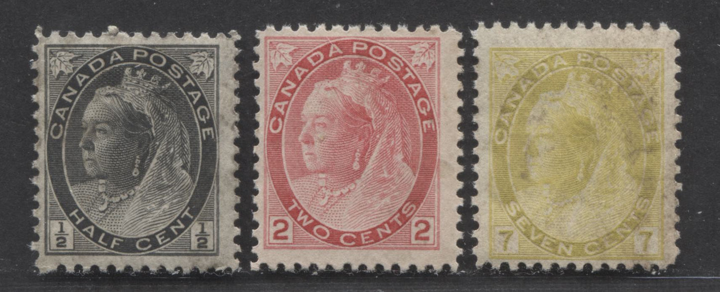 Lot 114 Canada #74, 77, 81 1/2c, 2c, 7c Grey Green, Carmine, Olive Yellow, 1898 - 1902 Queen Victoria "Numeral" Issue, 3 Fine Unused Singles Unused, Some Mildew Discoloration, Should Come Out With a Good Soak