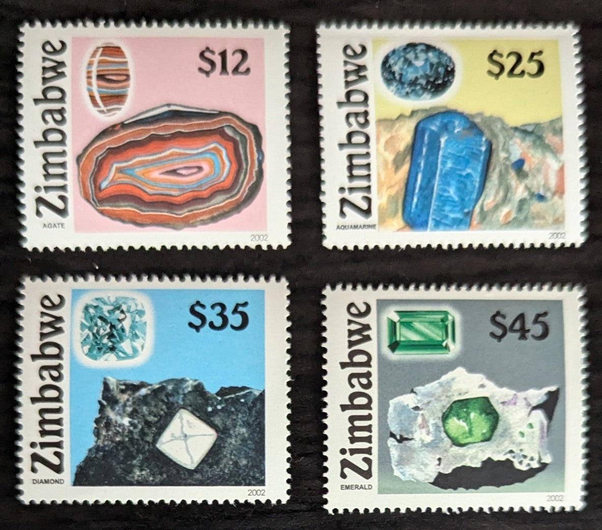 Lot 206 Zimbabwe SC#909-912 2002 Gemstones Issue, 4 VFNH Singles, Click on Listing to See ALL Pictures, 2017 Scott Cat. $12