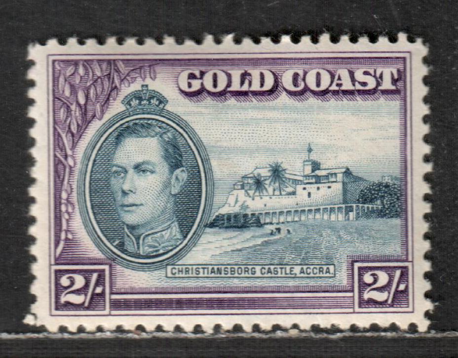 Lot 44 Gold Coast SG#130 2/- Blue & Violet 1938-1941 George VI And Christiansborg Castle Issue, 1938 Printing With Uncommon Line Perf 12, Instead Of Comb 11 1/2x12, A VFOG Single, Click on Listing to See ALL Pictures, Estimated Value $35