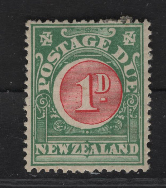 Lot 101 New Zealand SG#D24 1d Carmine & Green Numeral, 1919-1920 Postage Due, A VFOG Single, De la Rue Paper, Perf 14x15 Stamp Has Two Light Diagonal Bends