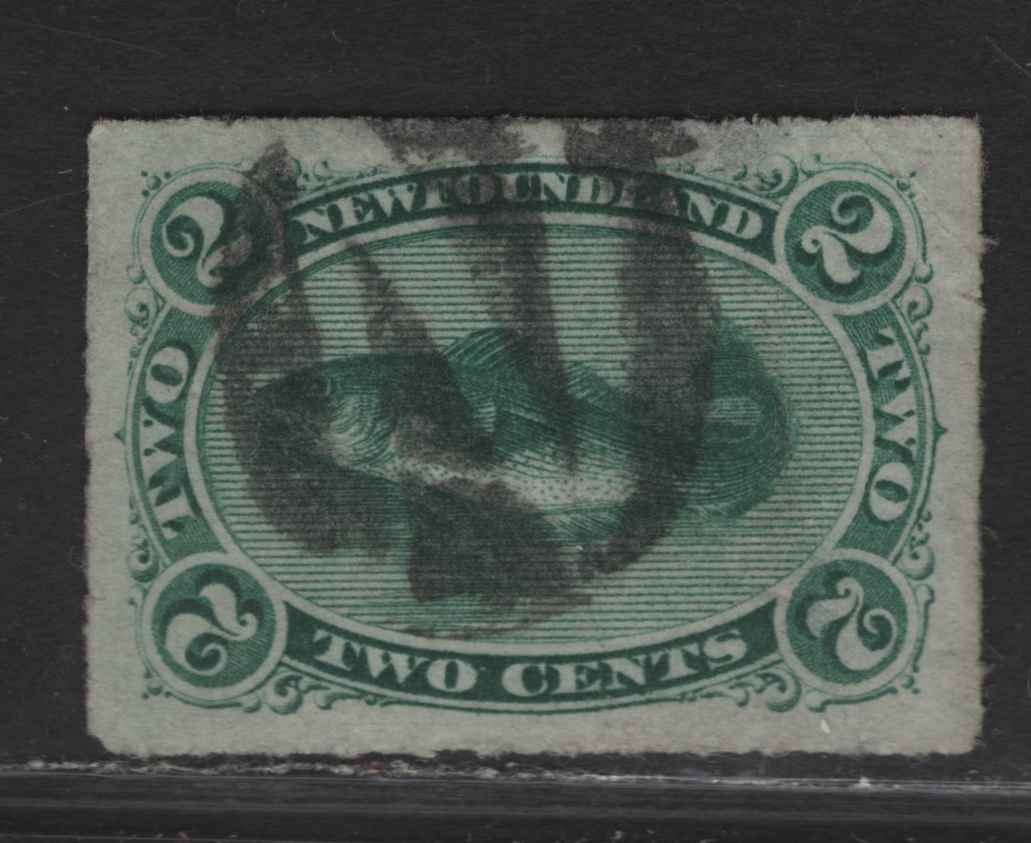 Lot 23 (C) Newfoundland #38 2c Green Codfish, 1876-1879 3rd Cents Issue, A Fine Used Rouletted Single, Beautifully Centered Example With N Negative Fancy Cork Cancel, Paper Cents-Y, Light Diagonal Crease That Is Not Visible From The Front.