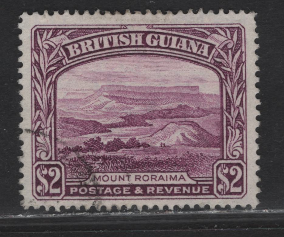 Lot 209 British Guiana (C) SG#318a $2 Purple King George VI, 1938-1952 KGVI Pictorial Issue, A Very Fine Used Single, Perf 14x13, 1950 Printing is the New Perf, Scarer Used Than Mint.