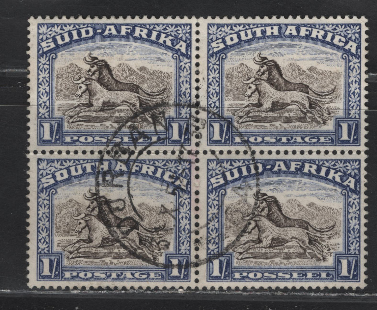 Lot 100 South Africa (C) SG#120a 1/- Blackish Brown & Ultramarine Pictorials, 1947-1954 Pictorial Issue, A Very Fine Used Block Of 4, October 31 1952 Durban CDS