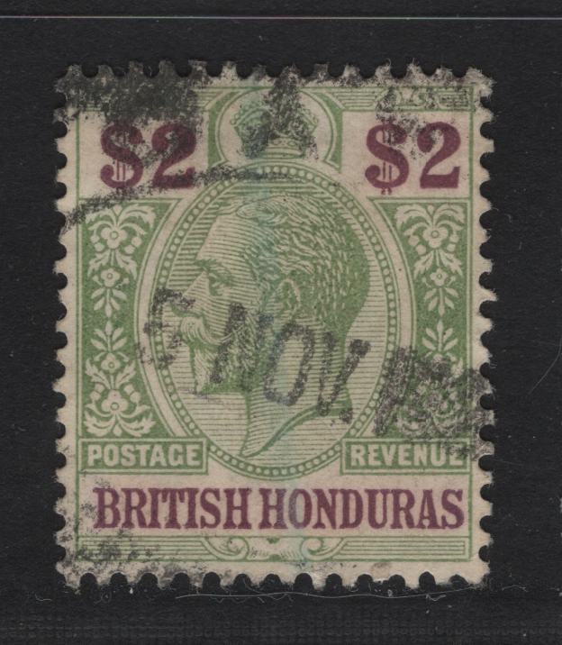 Lot 242A British Honduras SG#109 $2 Purple & Green King George V, 1913-1921 KGV Keyplate Issue, A Very Fine Used Single, Looks Like An Oval Parcel Cancel Rather Than Fiscal, Though It Could Be Fiscal