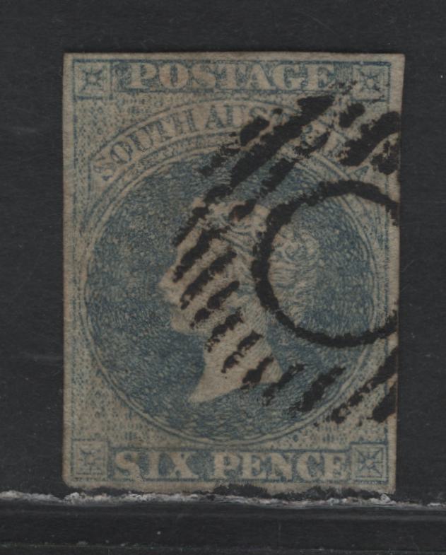 Lot 328 Australia - South Australia SG#10 6d Slate Blue , 1856-1858 Courbould Heads Issue, A Very Fine Used Single, Large Star Wmk, Adelaide Printing, Circle & Barred Grid Cancel, 3 Full Margins, Bottom Mostly Full But Roughly Torn.