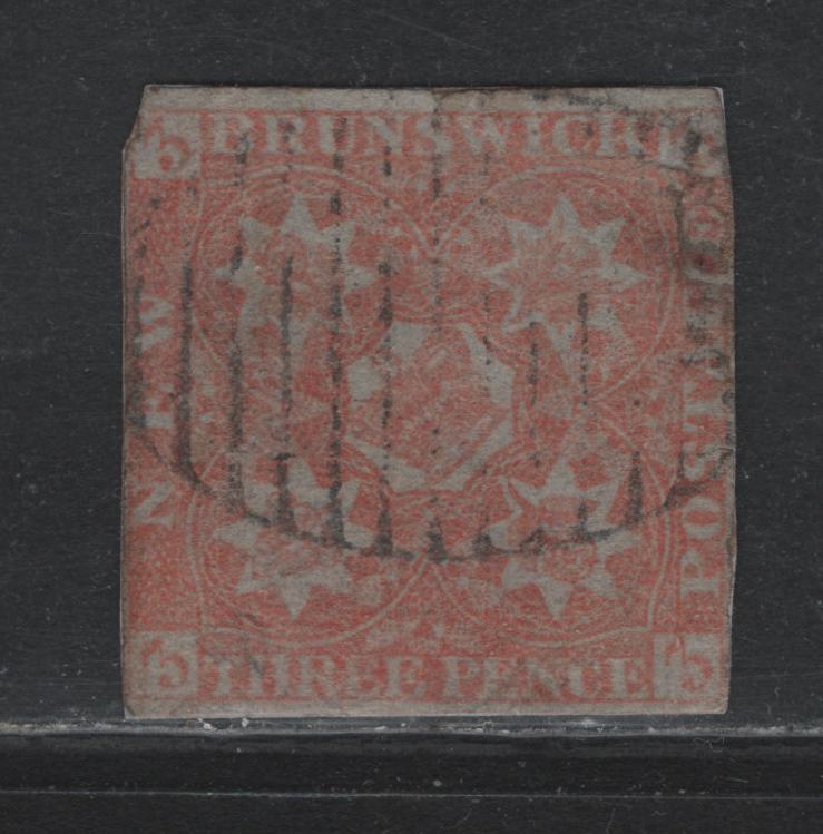 Lot 375 New Brunswick (C) #1 3d Pale Red , 1851 Pence Issue, An Ungraded Used Single, Severly Faulty Used Example Which Has Been Glued To Blue Paper To Hide The Faults, Which Are Mostly Confined to The Upper Right Corner