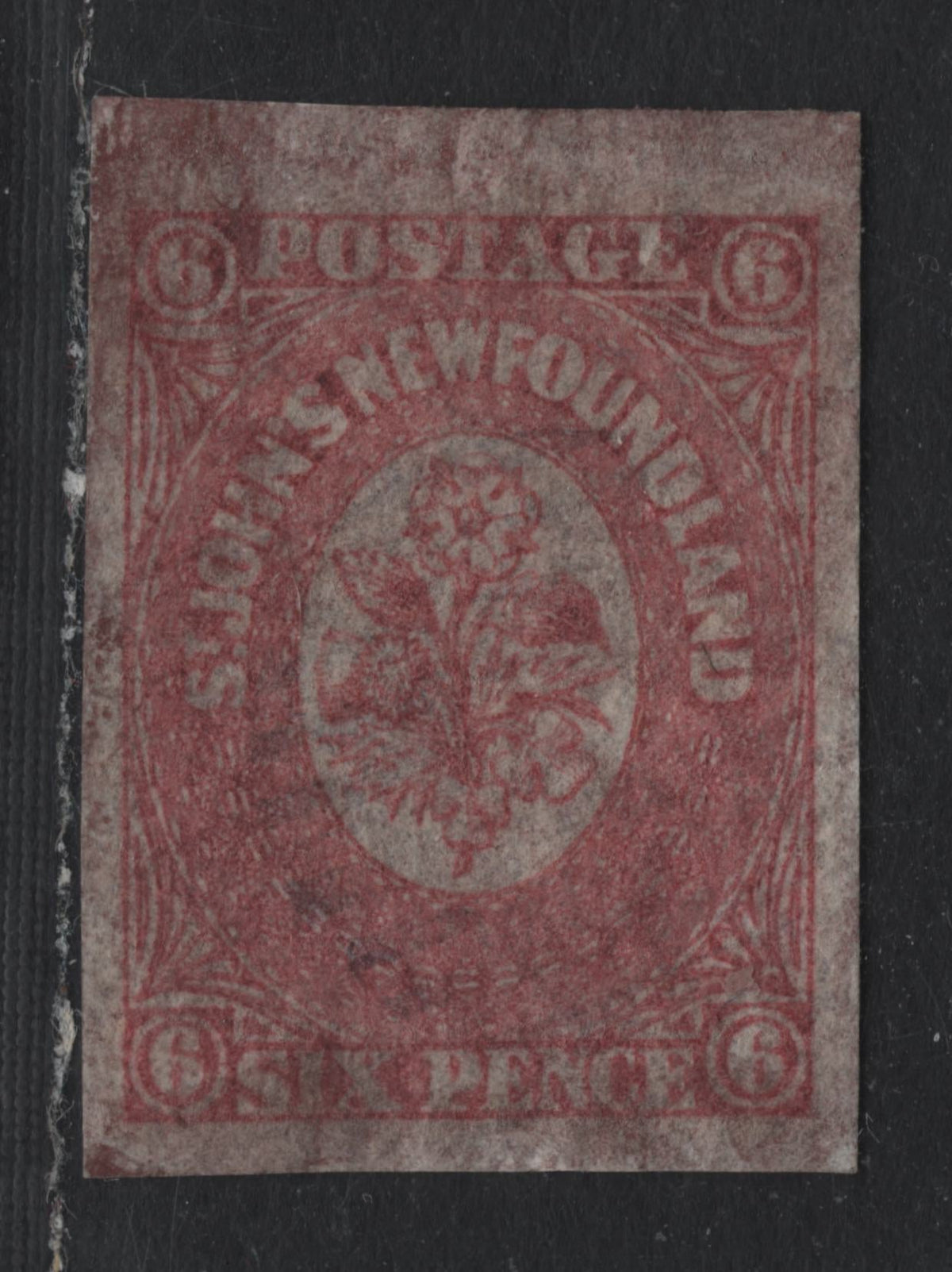 Lot 313 Newfoundland (C)#20 6d Rose , 1861-1862 Pence Issue, A Very Fine Used Single, Hard Translucent Wove Paper, Light Smudgy Overal Reddish Brown Cork Cancel Of Unknown Origin, Oversize Margin At Top.