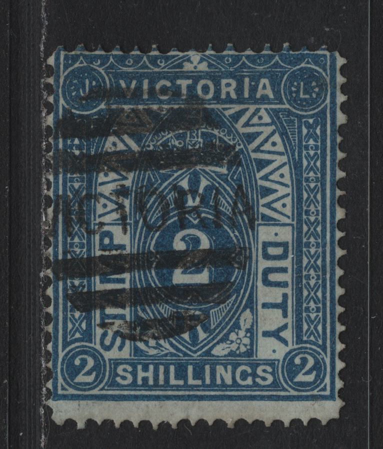 Lot 146 Australia - Victoria SG#258b (SC# AR37b) 2/- Deep Blue on Greenish , 1884-1896 Postal Fiscal Issue, A Fine Used Single, Glazed Paper, Perf 12.5, V Over Crown V1 Sideways Wmk, Victoria Barred Cancel.