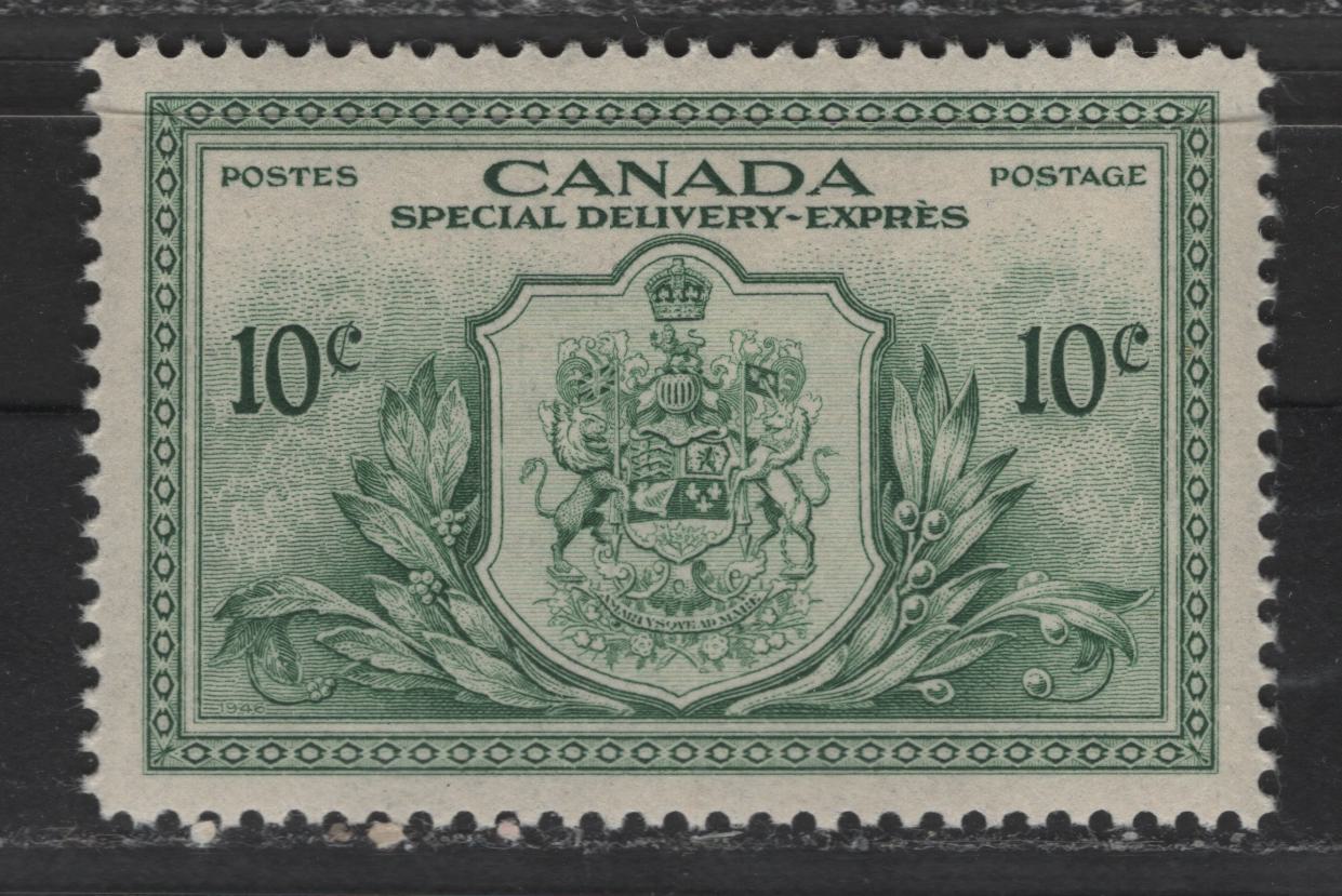 Lot 372 Canada #E11 10c Dull Green Coat Of Arms, 1946-1951 Peace Issue Special Delivery, A VFNH Singles On Vertical Wove Paper With Horizontal Mesh & Mottled Stain Cream