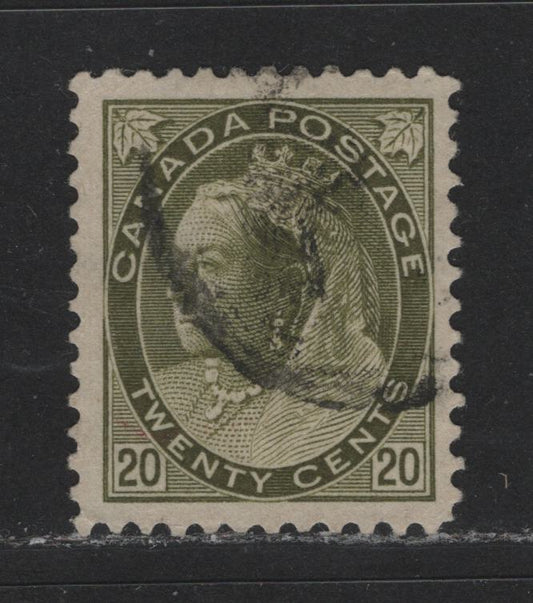 Lot 459 Canada #84 20c Olive Green Queen Victoria, 1898-1902 Numeral Issue, A Fine Used Single VF Appearance But Lower Left Perforation Tip Is Creased, So Fine